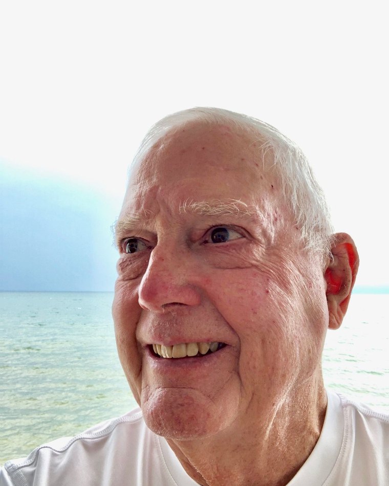 James R. Baker, smiling by the water